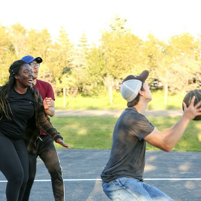 Students playing basketball at the Fall Retreat.