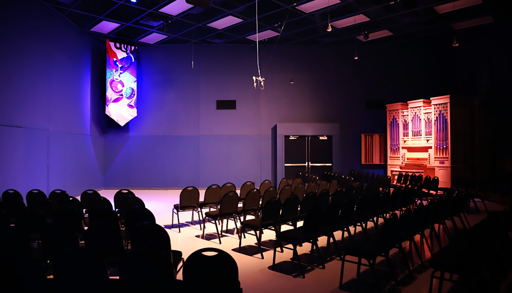 Intimate space for concerts, equipped with seating, sound and lighting.