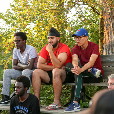 Students around a campfire at the Fall Retreat