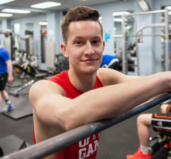 Male student in campus fitness centre
