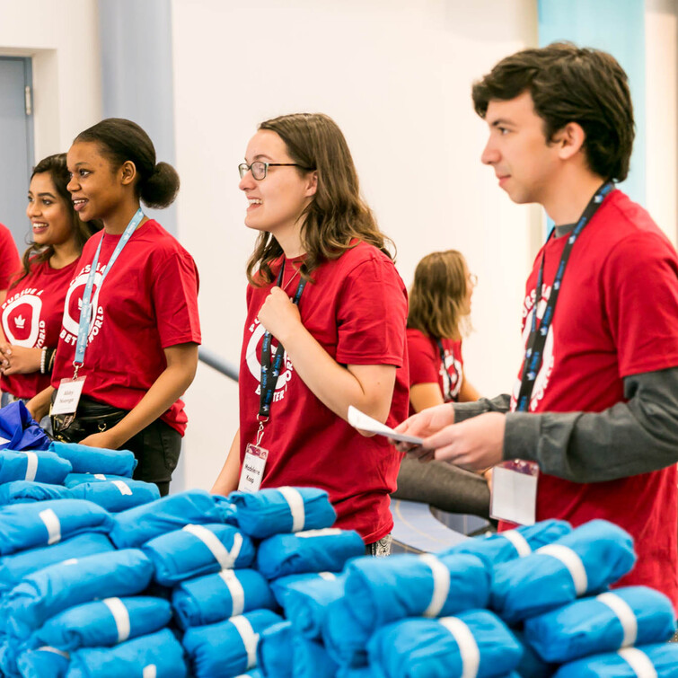 Student leaders handing out King's shirts at Orientation