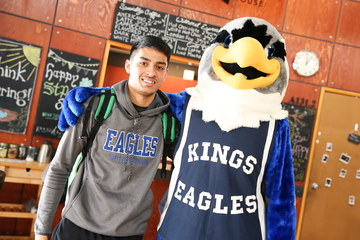 Narayan Ramdhani with Izzy the Eagle at the nationals pep rally